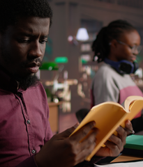 A man reads a book in a law library