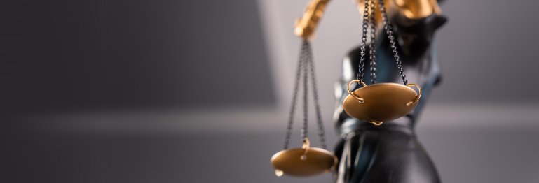 Close-up of Lady Justice holding scales